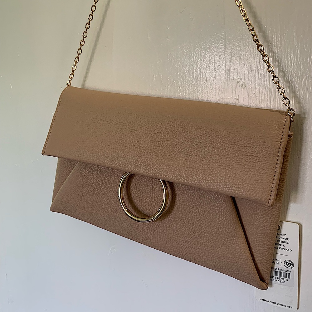 New with tag, Ring Clutch, Nude color, medium width.